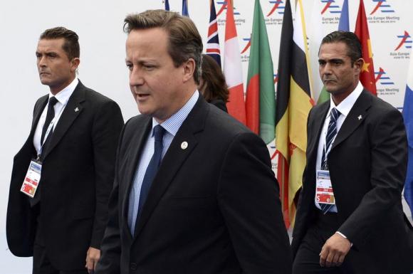 British Prime Minister Cameron arrives for the Asia-Europe Meeting at the congress center in Milan