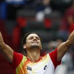 David Ferrer of Spain celebrates winning his men's singles tennis match against Andy Murray of Britain at the Shanghai Masters tennis tournament in Shanghai