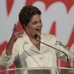 Brazil's President and Workers' Party (PT) presidential candidate Dilma Rousseff reacts a during news conference after voting in the first round of election in Brasilia