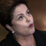 Brazil's President and Workers' Party presidential candidate Rousseff reacts during a news conference in Brasilia