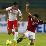 Egypt's Hossam Ghali fights for the ball with Ferjani Sassi of Tunisia during their African Nations Cup qualifying soccer match in Cairo