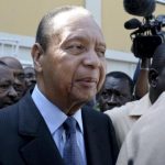 Haiti's former dictator Duvalier moves through the crowd of supporters, journalists and security after he was discharged from a private hospital in Port-au-Prince