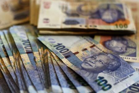 New South African bank notes featuring an image of former South African President Nelson Mandela are displayed at an office in Johannesburg