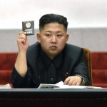 File photo shows North Korean leader Kim Jong-Un holding up his ballot during the fifth session of the 12th Supreme People's Assembly of North Korea in Pyongyang