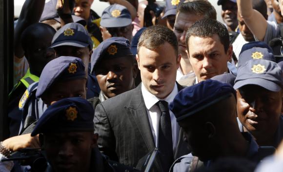 Olympic and Paralympic track star Oscar Pistorius arrives at the North Gauteng High Court in Pretoria