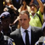 South African Olympic and Paralympic sprinter Oscar Pistorius leaves the North Gauteng High Court in Pretoria