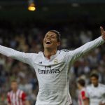 Real Madrid's Ronaldo celebrates after scoring his third goal against Athletic Bilbao during their Spanish first division soccer match in Madrid