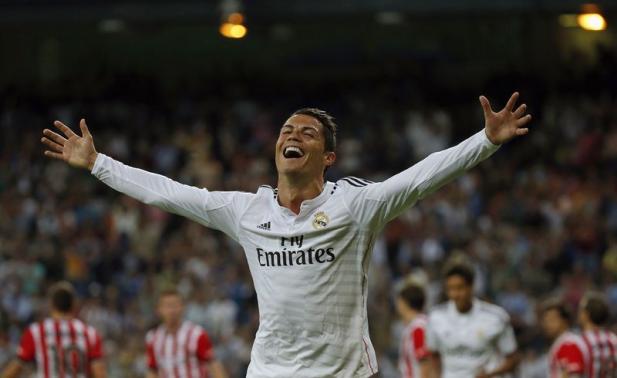 Real Madrid's Ronaldo celebrates after scoring his third goal against Athletic Bilbao during their Spanish first division soccer match in Madrid