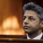 Honeymoon murder accused Shrien Dewani sits in the dock before the start of his trial in Cape Town