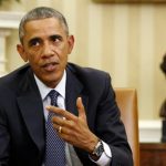 Obama talks to the press after meeting with his team coordinating the government's Ebola response in the Oval Office of the White House in Washington