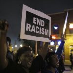Protesters demonstrate during a march through the streets late into the night, in St Louis, Missouri