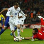 England's Wayne Rooney is denied by San Marino's Davide Simoncini during their Euro 2016 qualifying soccer match at Wembley Stadium in London