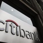 The Citibank logo is seen at the facade of a Citibank building in New York