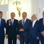 U.S. Secretary of State Kerry, Britain's Foreign Secretary Hammond, Russian Foreign Minister Lavrov, Iranian FM Zarif and German FM Steinmeier pose for photographers before a meeting in Vienna