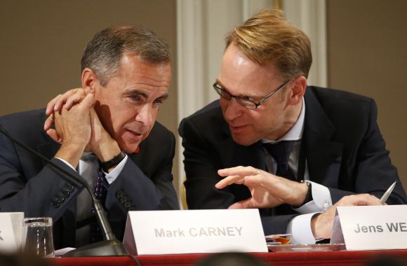 Bank of England Governor Mark Carney and Germany's Bundesbank President Jens Weidmann attend a conference of central bankers hosted by the Bank of France in Paris