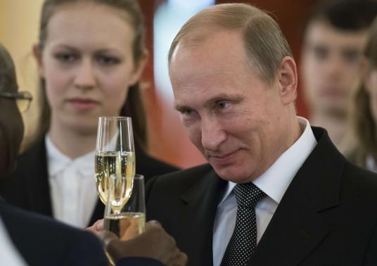 Russian President Vladimir Putin toasts with ambassadors during a ceremony to hand over credentials at the Kremlin in Moscow