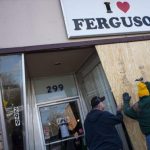 Volunteers board up the "I Love Ferguson" headquarters in preparation for the grand jury verdict in the shooting death of Michael Brown
