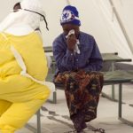 A health worker wearing protective gear