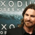 Christian Bale poses for photographs as he arrives for the film world premiere of "Exodus: Gods and Kings" in Madrid