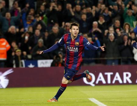 Barcelona's Messi celebrates after scoring his second goal against Espanyol during their Spanish first division soccer match at Nou Camp stadium in Barcelona