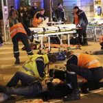 rescue workers tending at victims after a driver deliberately slammed