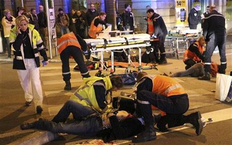 rescue workers tending at victims after a driver deliberately slammed
