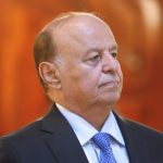 File photo of Yemen's President Hadi stands attending a reception during the holy fasting month of Ramadan at the Republican Palace in Sanaa