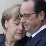 Francois Hollande embraces German Chancellor Angela Merkel
