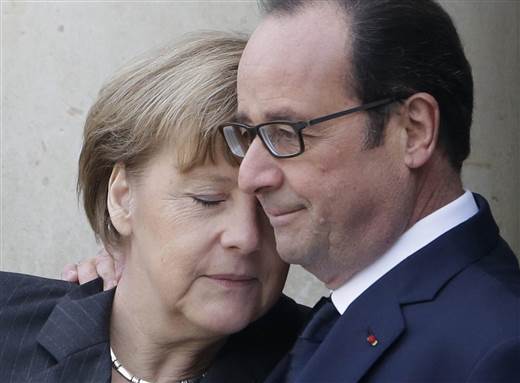 Francois Hollande embraces German Chancellor Angela Merkel