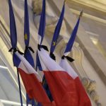 French flags are tied with black tissue at the Elysee Palace in a sign of mourning in Paris