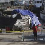 Indonesian people look at the wreckage of AirAsia Flight 8501