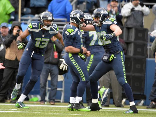 Russell Wilson, center, celebrates with tight end Luke Willson, right, after the Seahawks scored on a two-point conversion late in the fourth quarter. (Photo: Kirby Lee, USA TODAY Sports)