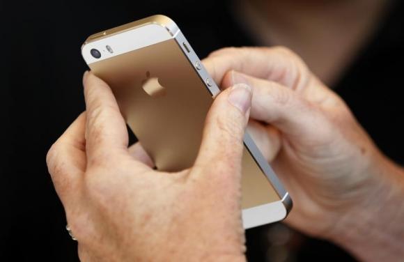 The gold colored version of the new iPhone 5S is seen after Apple Inc's media event in Cupertino