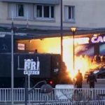 police officers storm a kosher grocery to end a hostage situation in Paris