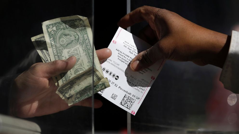 A woman buys a Powerball ticket
