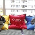 Attendees Dominie Liang and Ruslan Belkin utilize the common area at the Google I/O Developers Conference in the Moscone Center in San Francisco