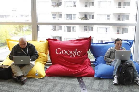 Attendees Dominie Liang and Ruslan Belkin utilize the common area at the Google I/O Developers Conference in the Moscone Center in San Francisco