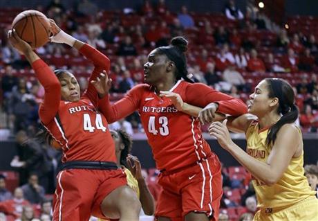 Betnijah Laney, left, Ariel Butts and Maryland