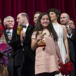 The niece of Iranian film director Panahi appears on stage with jury members and prize winners during awards ceremony at 65th Berlinale International Film Festival in Berlin