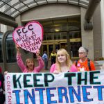 Protesters hold a rally at the Federal Communications Commission