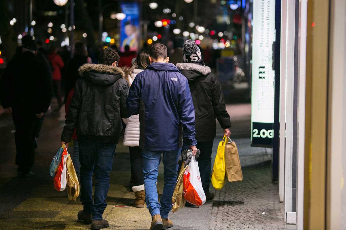 Shoppers carry shopping bags
