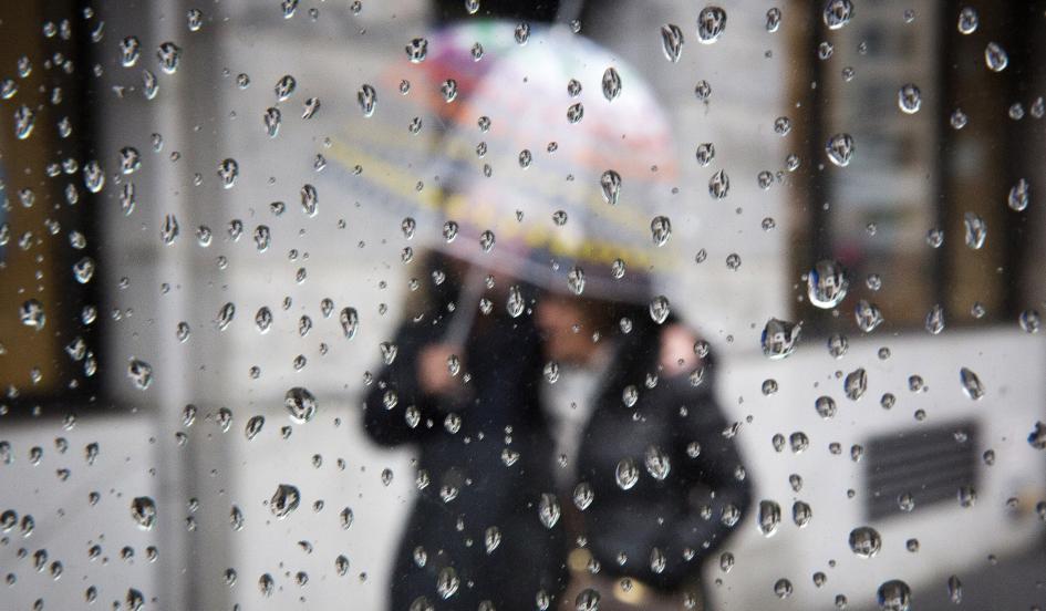 People walking under an umbrella