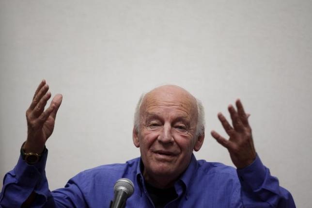 Uruguayan writer Eduardo Galeano gestures while addressing the audience at the municipal palace in Mexico City