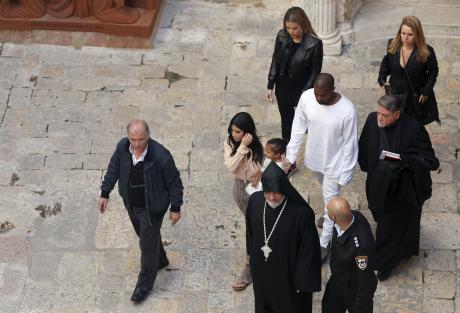 U.S. reality TV star Kardashian  walks on grounds of Cathedral of Saint James in Jerusalem's Old City