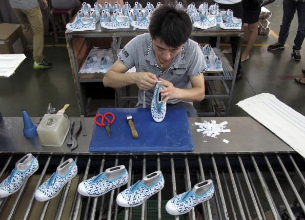 Employee works at a Shuangwei factory in Putian