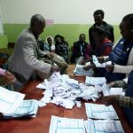 Election officials count votes at the end of the voting exercise in Ethiopia's capital Addis Ababa