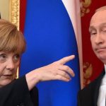 German Chancellor Angela Merkel (L) gestures as Russian President Vladimir Putin