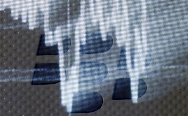 Illuminated stock graph is seen on a Blackberry logo on a Blackberry smartphone in this photo illustration taken in Zenica