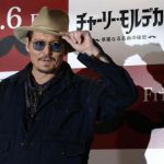 Actor Johnny Depp poses during a photo session ahead of a news conference for his movie "Mortdecai" in Tokyo