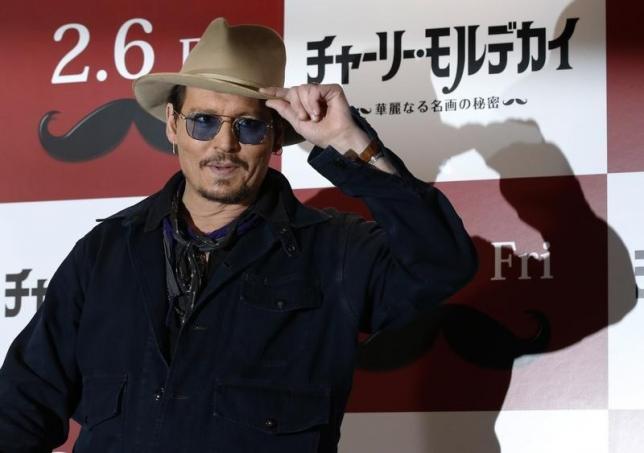 Actor Johnny Depp poses during a photo session ahead of a news conference for his movie "Mortdecai" in Tokyo